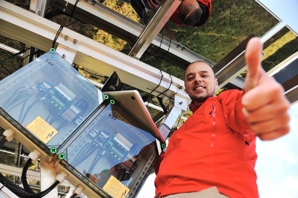 Engineer working with laptop installing  solar panels